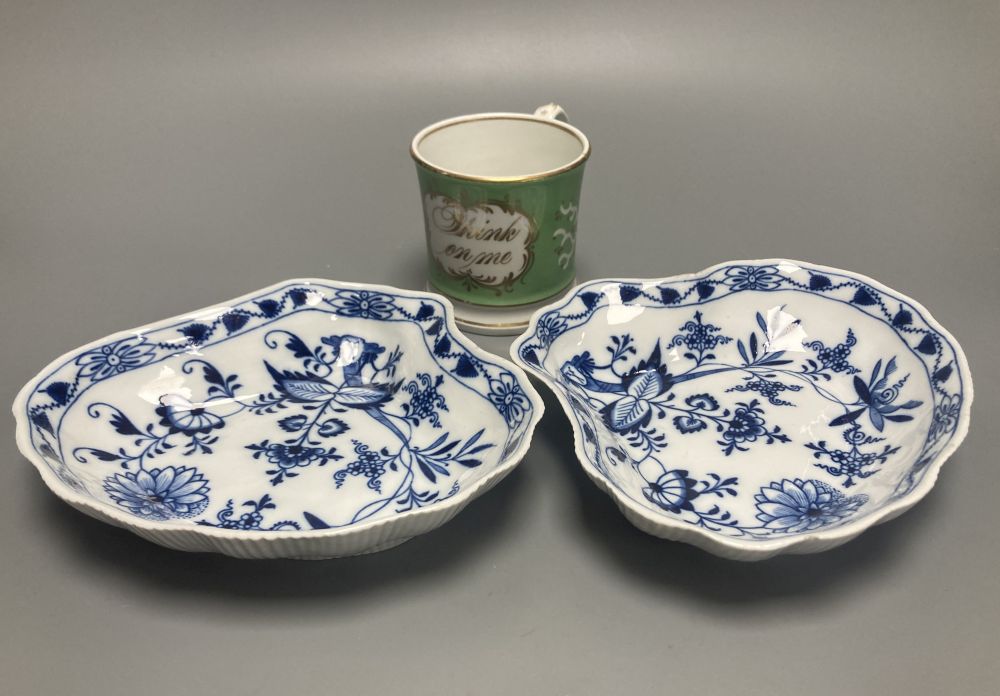 Two Meissen onion pattern shell-shaped dishes, width 19cm, and an English porcelain cabinet cup, inscribed in gilt, Think on me